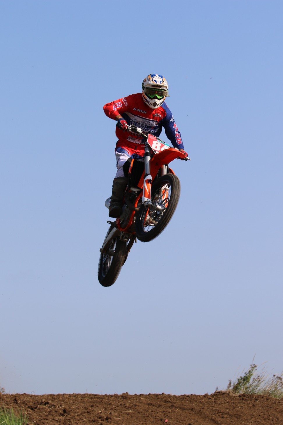 Motocross saut air rouge bleu
